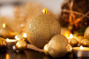 Image showing Warm gold and red Christmas candlelight background