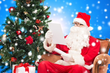 Image showing man in costume of santa claus with letter