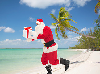 Image showing man in costume of santa claus with gift box