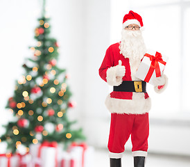 Image showing man in costume of santa claus with gift box