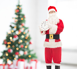 Image showing man in costume of santa claus with clock