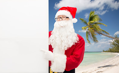 Image showing man in costume of santa claus with billboard