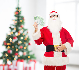 Image showing man in costume of santa claus with euro money