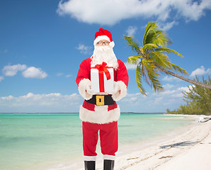 Image showing man in costume of santa claus with gift box