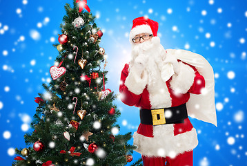 Image showing santa claus with bag and christmas tree