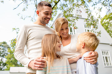 Image showing happy family in front of house outdoors