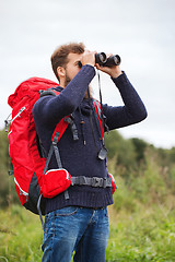 Image showing man with backpack and binocular outdoors