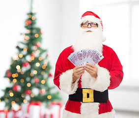 Image showing man in costume of santa claus with euro money