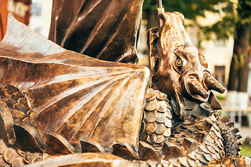 Image showing Statue Of Archangel Michael With Outstretched Wings Before Red C