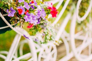 Image showing White Decorative Bicycle Parking In Garden 