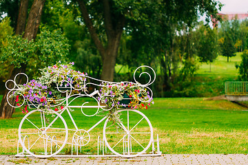 Image showing White Decorative Bicycle Parking In Garden 