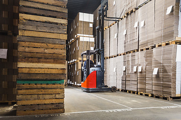 Image showing forklift lifting a pallet