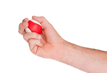 Image showing Male hand with a red and white ball