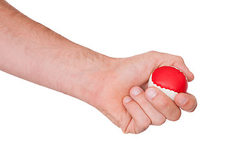 Image showing Male hand with a red and white ball