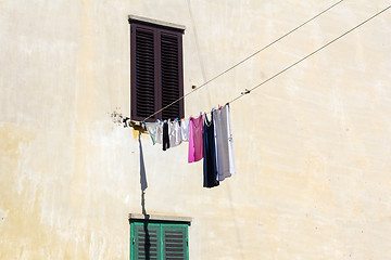 Image showing Drying clothes on the wall