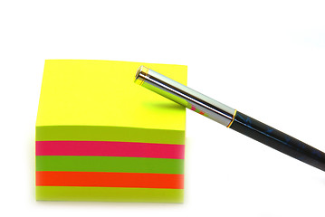 Image showing Stack of post its and a pen