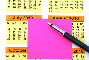Image showing Pink post it on calendar
