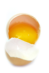 Image showing Broken egg on white