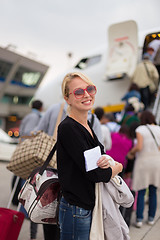 Image showing Woman boarding airplane.