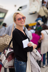 Image showing Woman boarding airplane.