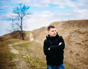 Image showing Young Handsome Man Stayed In Field, Meadow In Autumn Day