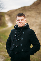 Image showing Young Handsome Man Stayed In Field, Meadow In Autumn Day