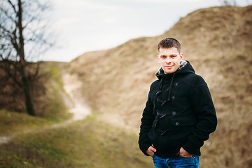 Image showing Young Handsome Man Stayed In Field, Meadow In Autumn Day