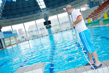 Image showing help and rescue on swimming pool