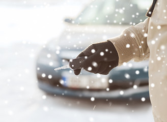 Image showing close up of man with car key outdoors