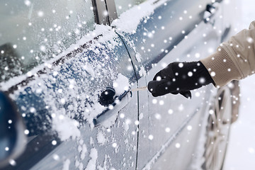 Image showing close up of man with car key outdoors