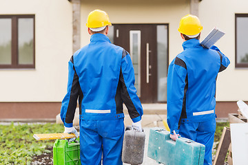 Image showing group of builders with toolboxes