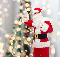 Image showing man in costume of santa claus with bag