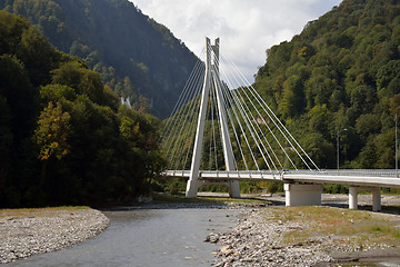 Image showing A long mountain bridge