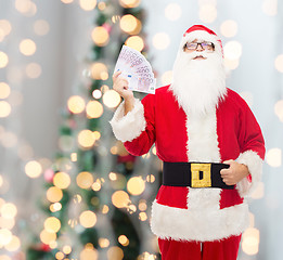 Image showing man in costume of santa claus with euro money