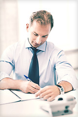 Image showing handsome businessman working in the office