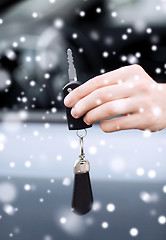 Image showing close up of man with car key outdoors