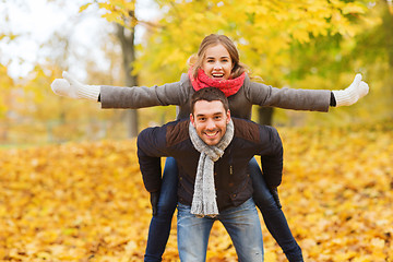 Image showing smiling couple having fun in autumn park