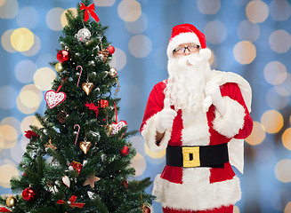 Image showing santa claus with bag and christmas tree