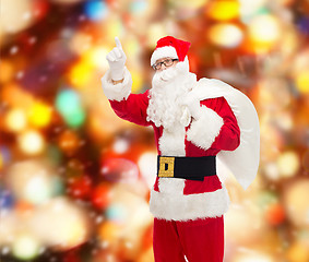 Image showing man in costume of santa claus with bag