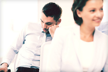 Image showing tired businessmen sleeping on conference