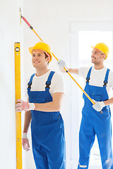 Image showing group of builders with tools indoors