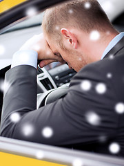 Image showing close up of businessman driving car