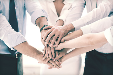 Image showing business team celebrating victory in office