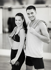 Image showing two smiling people in the gym