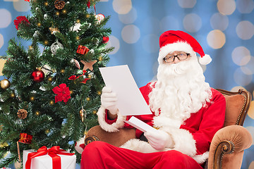 Image showing man in costume of santa claus with letter