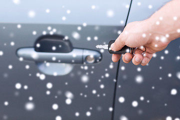 Image showing close up of man with car key outdoors