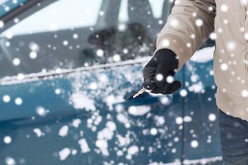 Image showing close up of man with car key outdoors