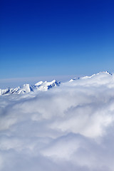 Image showing Mountains in clouds at nice sun day