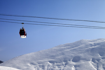 Image showing Gondola lift and off-piste slope at sun morning