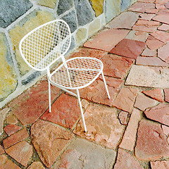 Image showing White chair on bright tile background